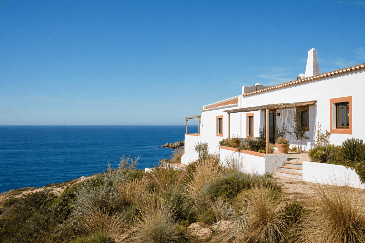 Chalk-white guesthouse overlooking Portugal's Vicentine Coast